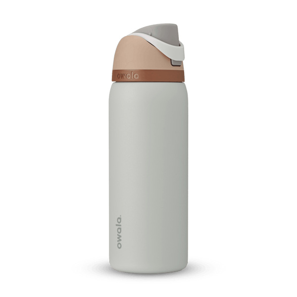 FreeSip 32oz in Calm Waters, pale gray body with peach flip cap, white carry loop, and copper accent band