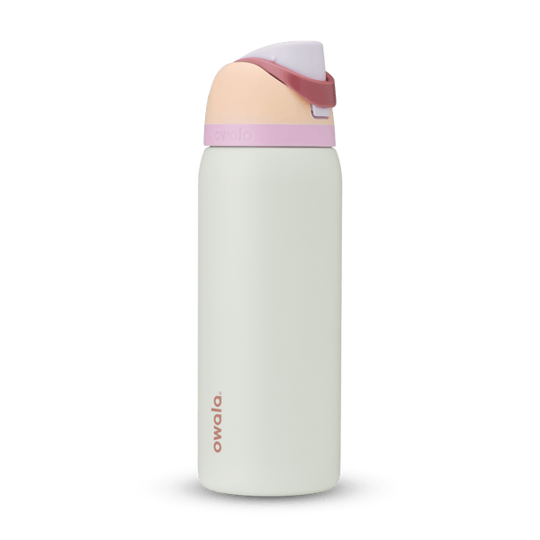 FreeSip 32oz water bottle, off-white body with blush peach lid base and soft pink carry loop