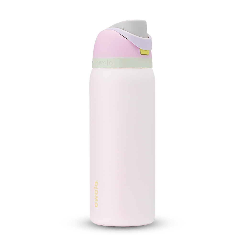 FreeSip 32oz in Candy Coated; soft pink body with pink flip cap, lavender carry loop, sage green accent band on the lid, and yellow push-button