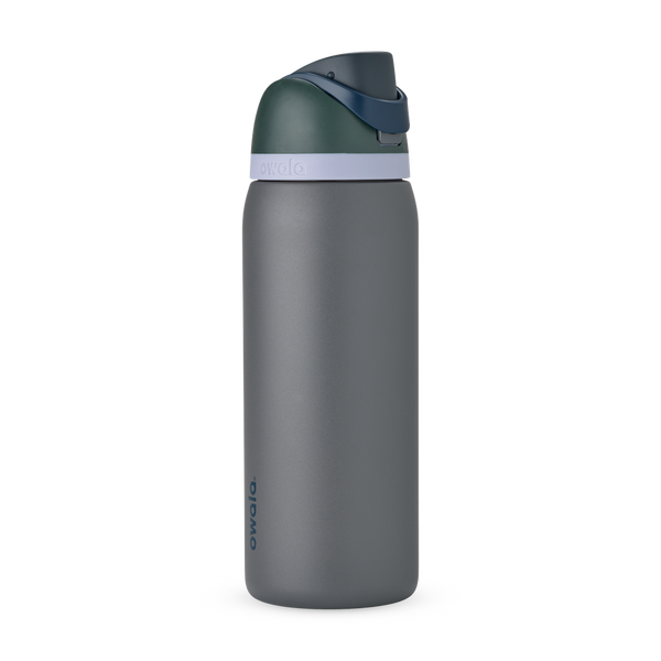 FreeSip 32oz in Off the Grid, charcoal grey body with dark forest green flip cap, navy blue carry loop, and pale lavender accent band