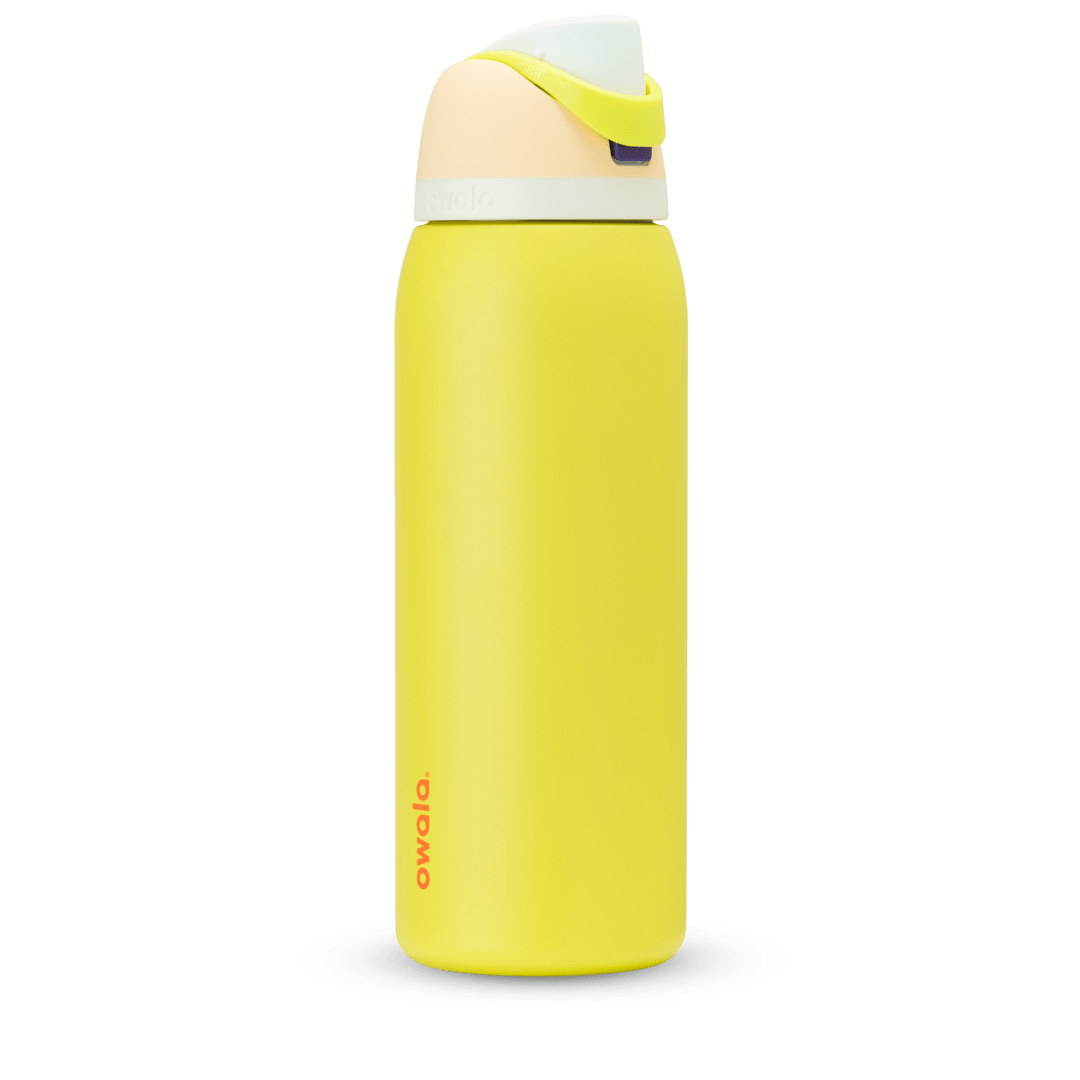 FreeSip 40oz in Lemon Limeade, bright yellow body with peach lid, neon yellow-green carry loop, white accent band, and orange logo