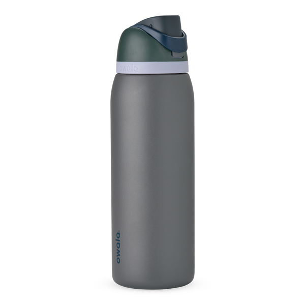 FreeSip 40oz in Off the Grid, charcoal grey body with dark forest green flip cap, navy blue carry loop, and pale lavender accent band