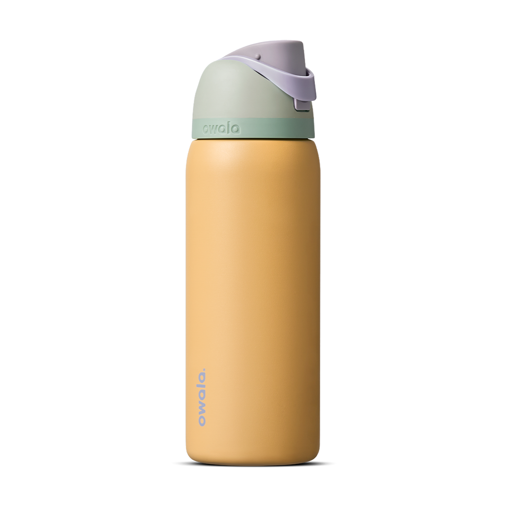 FreeSip 32oz in Beachfront, warm golden yellow insulated bottle with mint green accent band, lavender flip cap, and lavender carry loop
