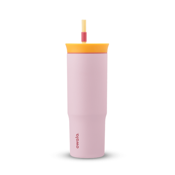 24oz Tumbler in Candy Store; matte light pink insulated tumbler with golden yellow lid, coral-red accent ring, and yellow straw with red grip, Owala wordmark on front