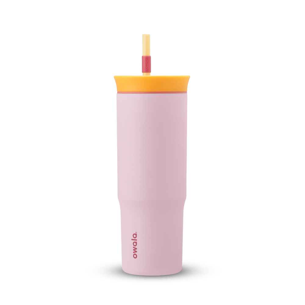 24oz Tumbler in Candy Store; matte light pink insulated tumbler with golden yellow lid, coral-red accent ring, and yellow straw with red grip, Owala wordmark on front