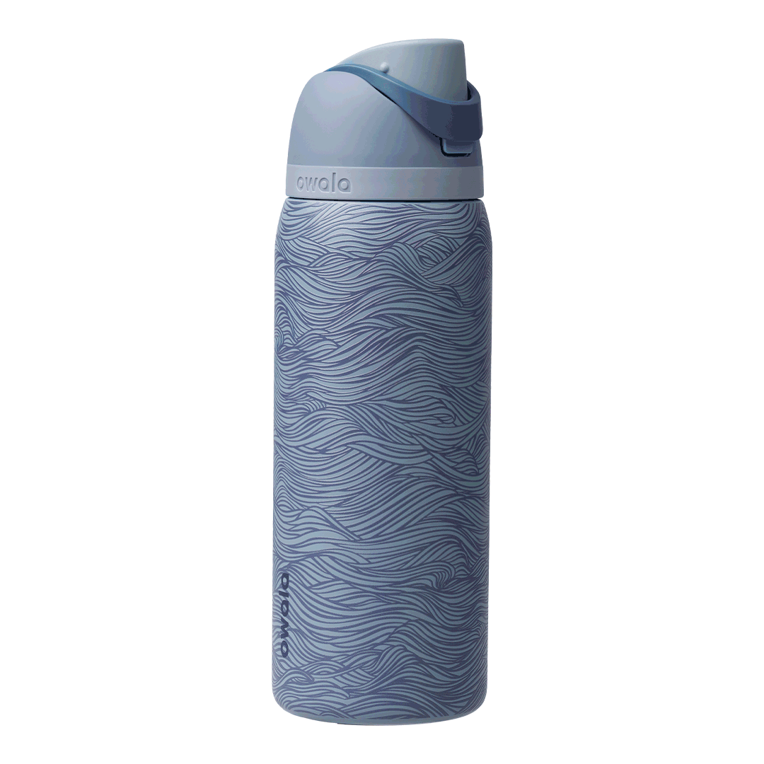 FreeSip 24oz Feeling Swell; rotating view of slate blue body with flowing wave line pattern in lighter blue tones, light blue flip cap, slate blue carry loop, and light blue lid Main image