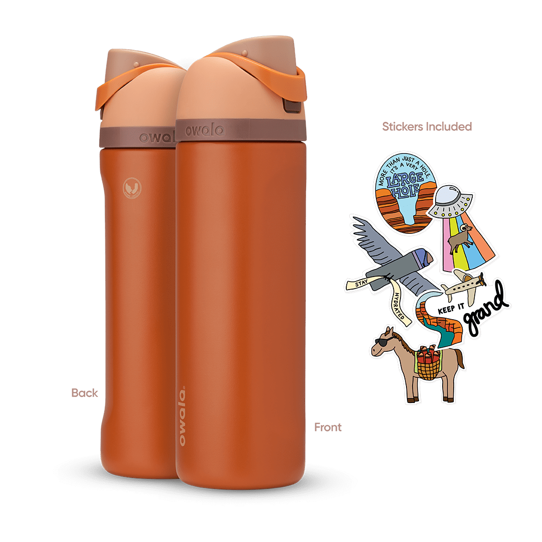 Great American Road Trip FreeSip 24oz in Grand Canyon, warm terracotta-orange body with peach flip cap, mauve carry loop, and brown lid accent band; back and front views shown with included national park-themed stickers featuring an eagle, horse, UFO, and "Keep It Grand" rainbow Main image