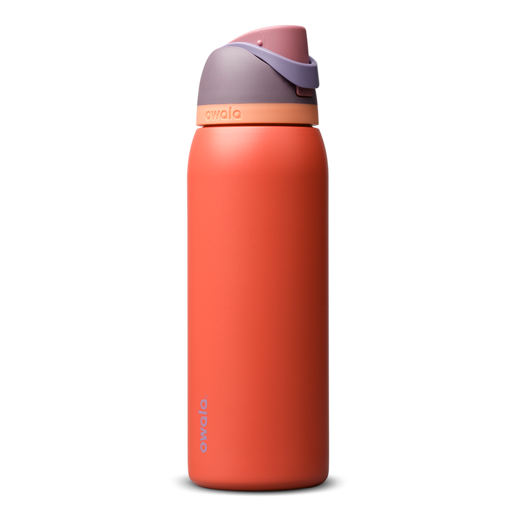 FreeSip 40oz in Terracotta Sunset, warm terracotta orange insulated bottle with muted mauve purple flip cap and peach accent band