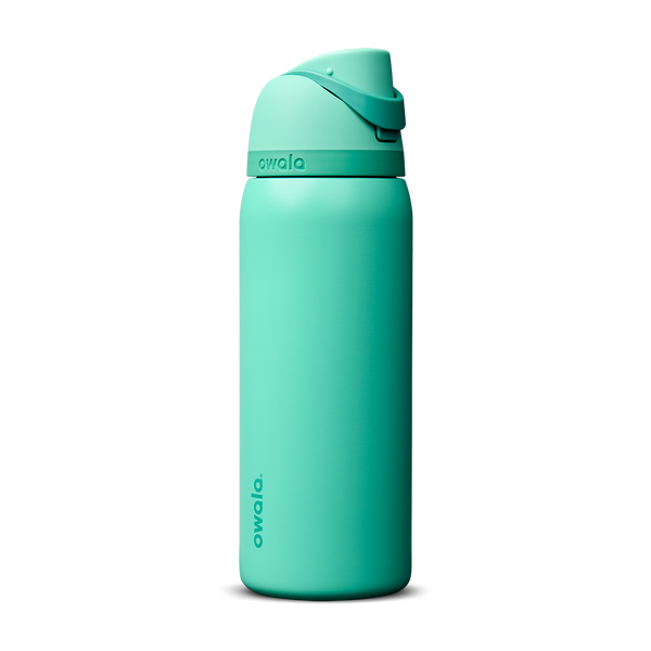 Owala FreeSip 32oz in 90s Kid, bright mint teal insulated bottle with matching teal flip cap and carry loop