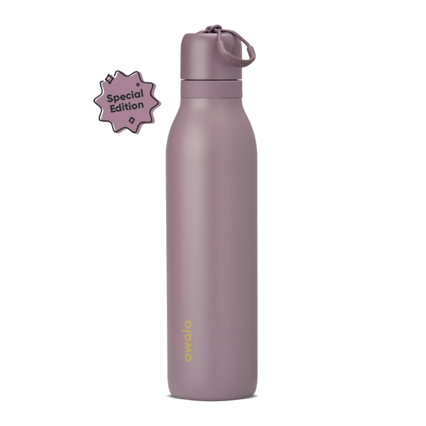 FreeSip Twist 24oz in Spring Revival, dusty mauve-purple insulated bottle with matching twist cap and carry string, gold Owala logo