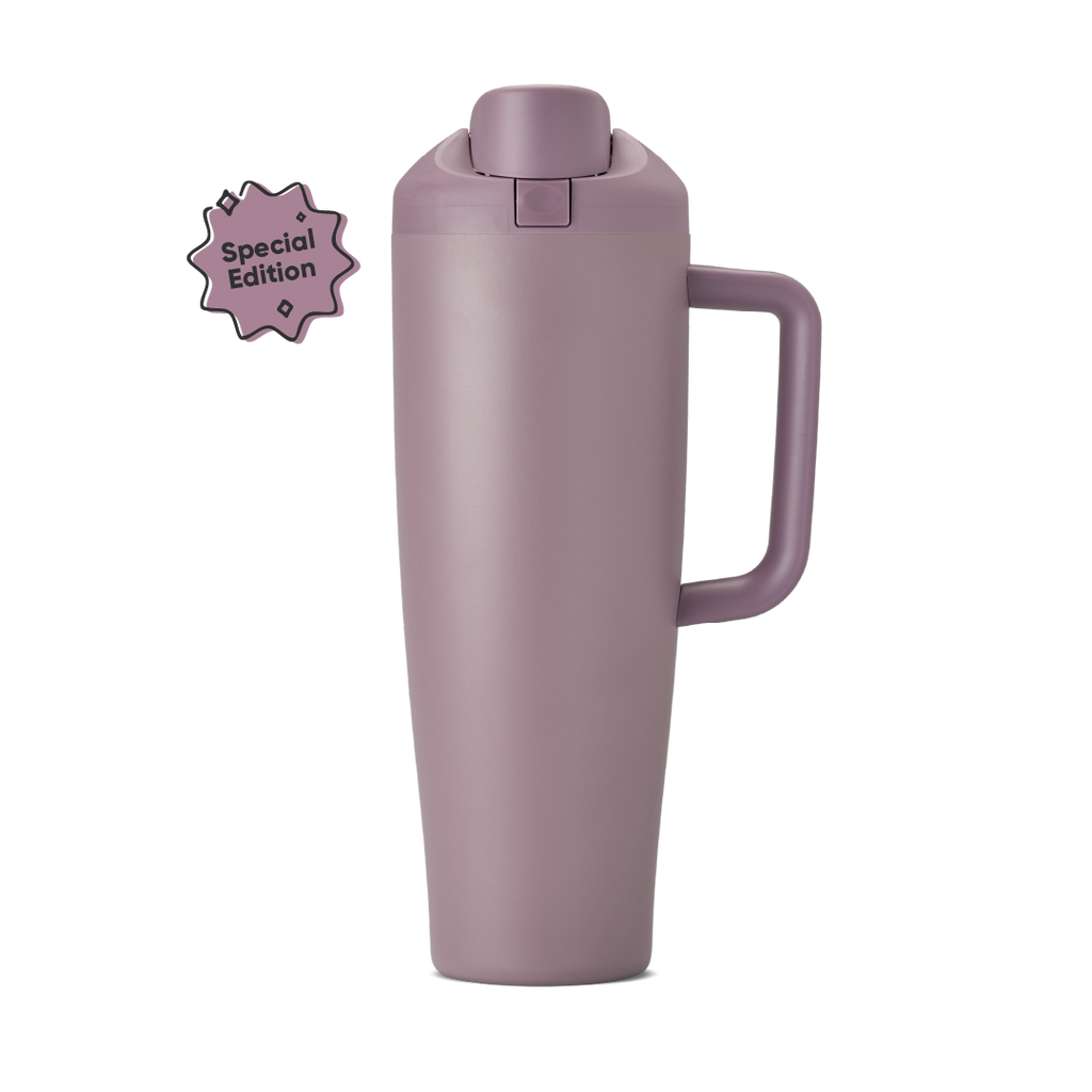 FreeSip Tumbler 40oz in Spring Revival, dusty mauve-purple insulated cup with matching flip cap, push-button, lid, and side handle