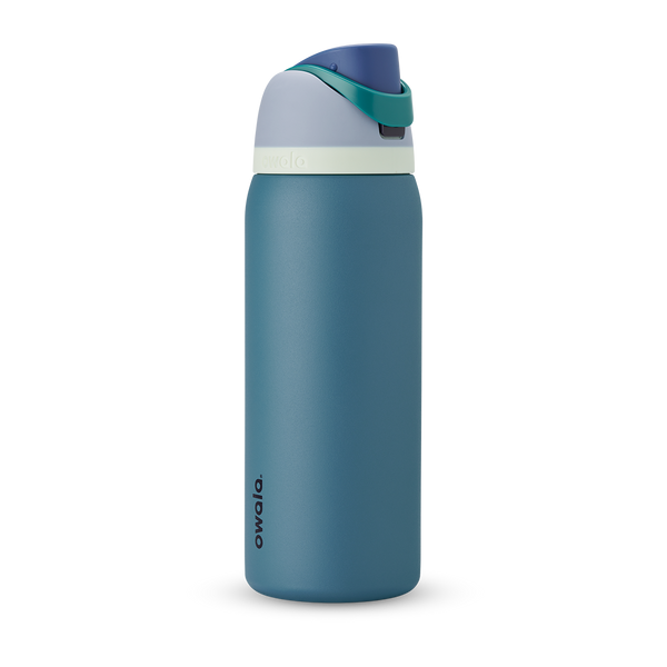 FreeSip 40oz in Denim, muted teal blue insulated bottle with dusty navy flip cap and pale cream accent band