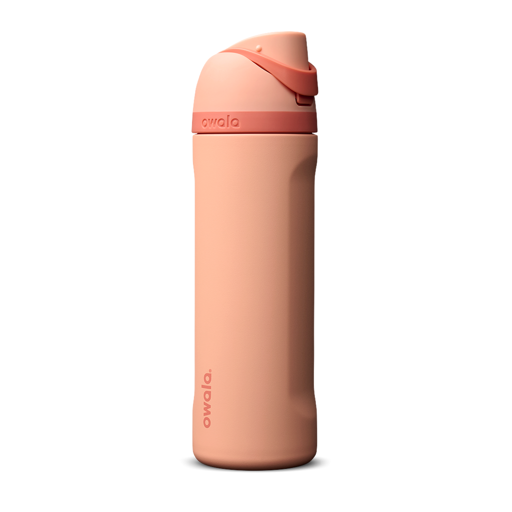 Owala FreeSip 24oz in Peach of Mind, soft coral peach insulated bottle with matching peach flip cap and carry loop