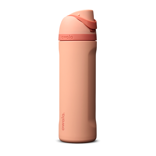 Owala FreeSip 24oz in Peach of Mind, soft coral peach insulated bottle with matching peach flip cap and carry loop