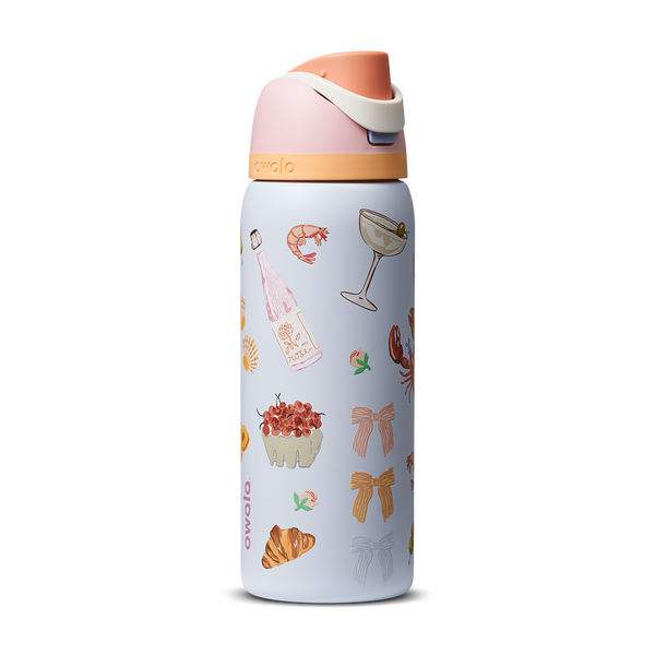 FreeSip 32oz in Picnic Prep, light periwinkle blue body with scattered picnic-themed print (croissants bows cocktail glasses) and peach-salmon flip cap