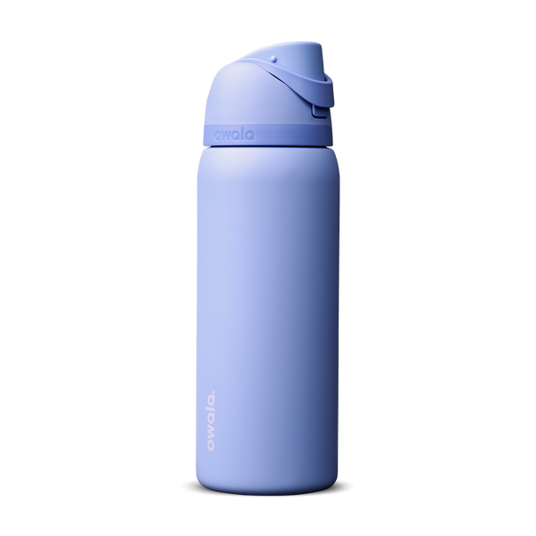 Owala FreeSip 32oz in Out of the Blue, periwinkle blue insulated bottle with matching blue-lavender flip cap and carry loop