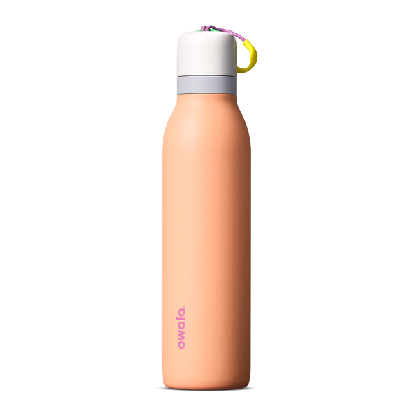 FreeSip Twist 24oz in Peachy Keen (soft coral-peach) with a light grey lid and multicolor loop accent, shown