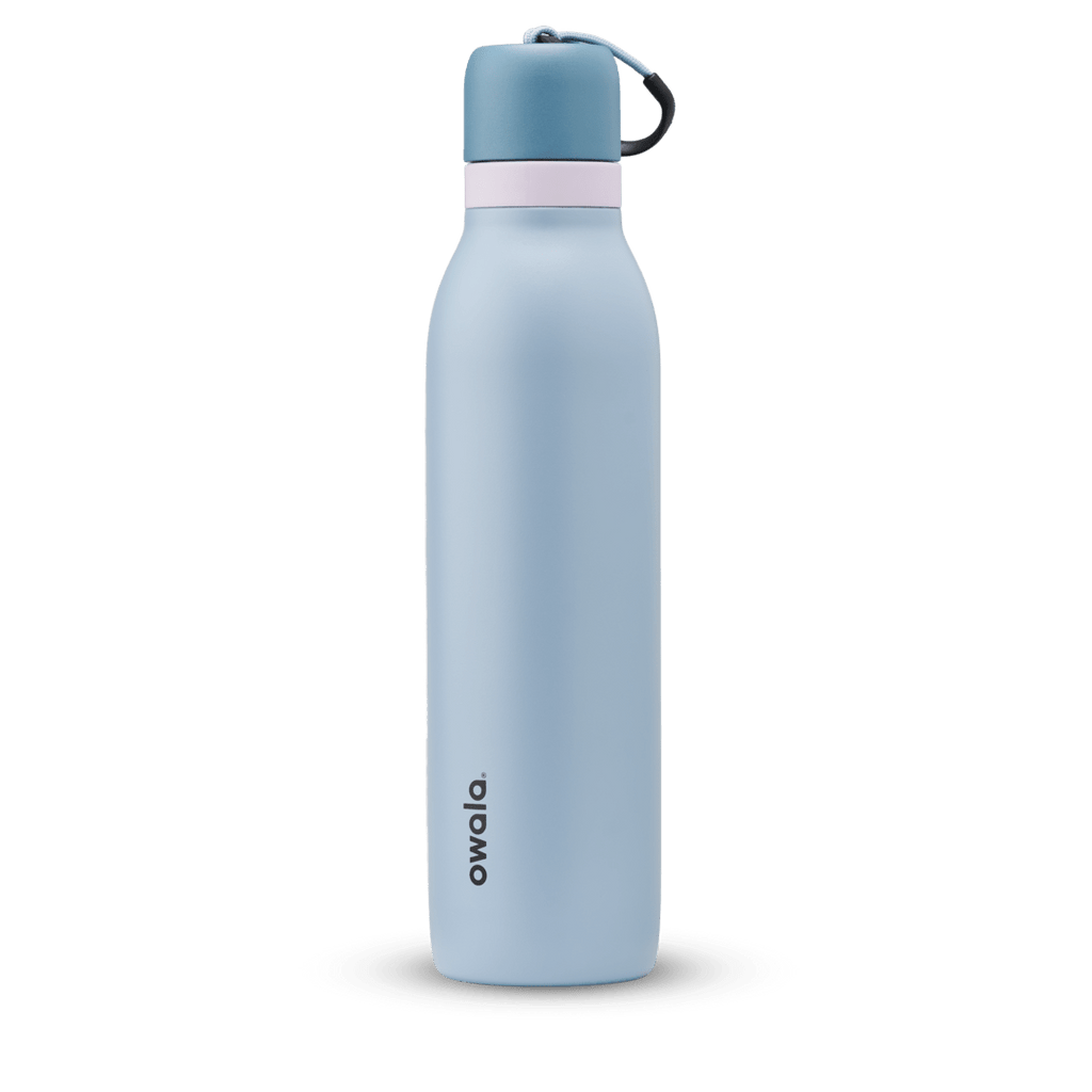 FreeSip Twist 24oz in Rainstorm, light powder blue insulated water bottle with darker slate blue twist cap, pale pink twist cap accent band, and dark navy carry string