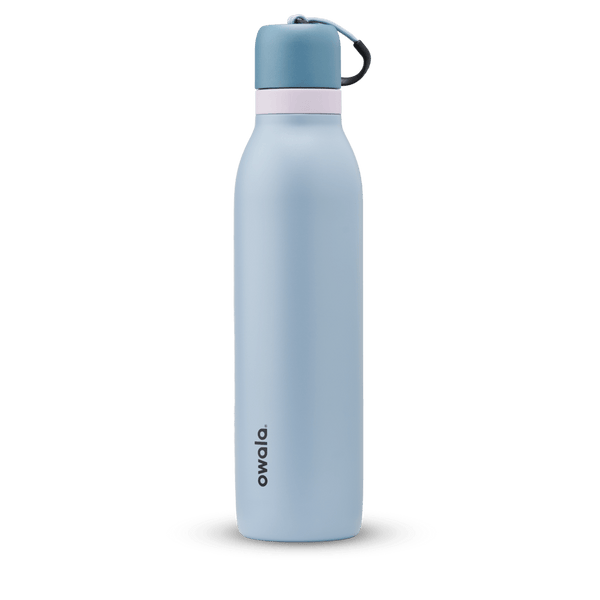 FreeSip Twist 24oz in Rainstorm, light powder blue insulated water bottle with darker slate blue twist cap, pale pink twist cap accent band, and dark navy carry string