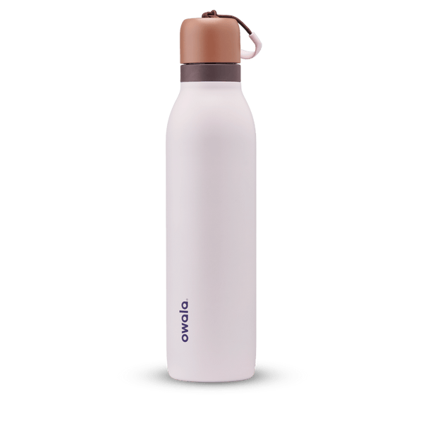 FreeSip Twist 24oz in Sleepy Lavender, soft pale lavender insulated water bottle with copper-orange twist cap, dark plum twist cap accent band, and pink carry string with brown grip