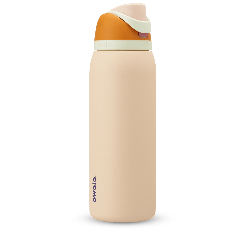 FreeSip 40oz in Water in the Desert, sand tan body with orange flip cap, mint green carry loop, and tan lid