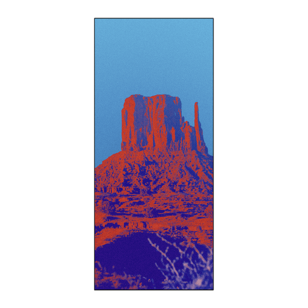 Owala Beach Towel in Wild Wild West; vibrant pop-art red and orange desert rock formation print on a bright blue background