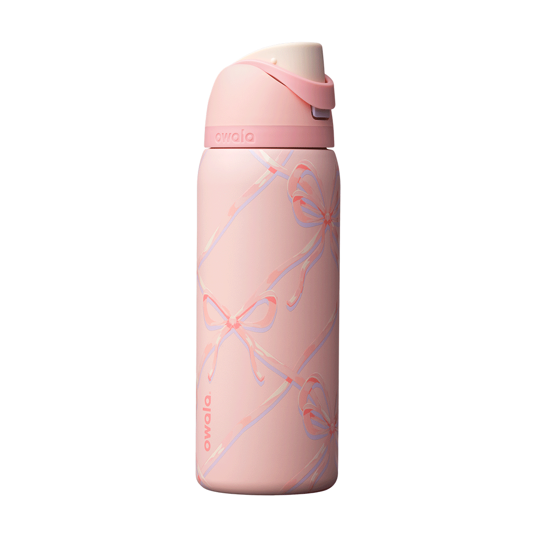 FreeSip 32oz Sugar Plum Fairy; rotating view of light pink body with diagonal lattice pattern of pastel pink, lavender, and cream ribbon bows, matching pink flip cap, pink carry loop, and cream push-button Main image
